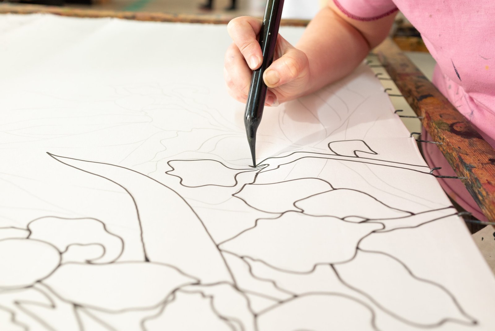 artist-creating-detailed-floral-patterns-with-blac-2025-01-10-05-24-55-utc-scaled